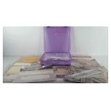 Scrapbooking supplies with storage bin