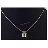 Silvertone necklace With A Pendant Of Clear Stone