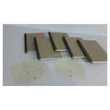 Group of blank notebooks and postcards, for craft