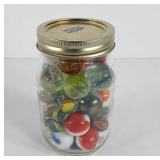 Jar of marbles, shooter marbles, and bouncy balls