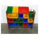 Toy storage bins in rack. Missing one small bin