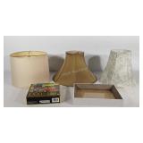 Three lamp shades, deep well picture frame, and