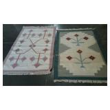 Two wool scatter rugs, floral design, each