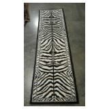 Zebra striped runner rug. Needs cleaning.