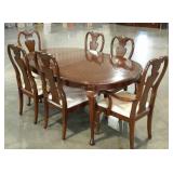 Dining table with two captains chairs and four