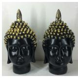 Pair of black and gold-tone Buddha head statues -