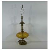 Decorative brass lamp with amber glass, no shade,