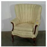 Scalloped upholstered living room chair.  Has one