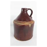 Stoneware whiskey jug, has some chips, see