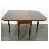 Drop leaf, gate leg dining table. Shows age and