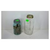 Two canning jars. One blue quart size ball jar