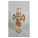 Porcelain dual handled vase with floral design,