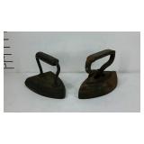 Two cast iron flat irons