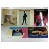 Three vinyl records and two laser discs, includes