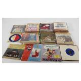 Vinyl records, 11" stack of 45rpms, many are