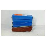 Group of four identical pocket knives, all with
