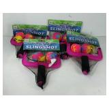 Four water slingshot pool toys, new in packaging.