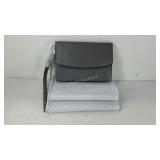 Three wristlet clutch purses, new in wrapping.