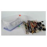 Art supplies, storage bin full of paint brushes