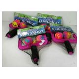Four water slingshot pool toys, new in packaging.