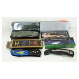 Group of four pocket knives, all with boxes.