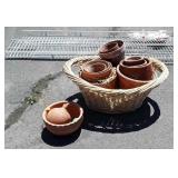 Several terracotta flower pots in Bamboo split