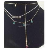 Jewelry, three plated necklaces and a marble like