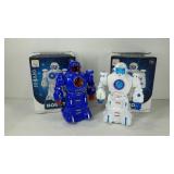 Two toy robots, in boxes. One blue, one white. 7"