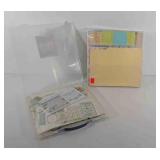 Two poly folders of scrapbooking supplies