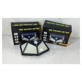 Two Solar Interaction wall lamps, new in box.