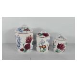 Ceramic floral canister set, one lid has chip in