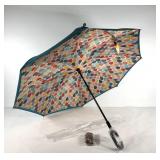 Umbrella, new in packaging with matching sleeve.