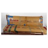 Two opened boxes of Bruce hardwood flooring,