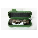Camo, 4" rechargeable LED flashlight in storage