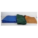 Three used tarps, one with drawstring