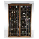 Shot glass collection in curio wall case,