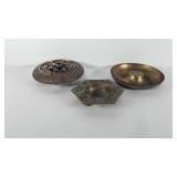 Three brass bowls