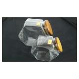 Two glass cookie or candy jars, wood lids,