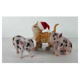 Three animal statues, two piglets, and one