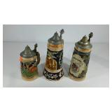 Three German steins, one features a ballerina and