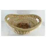 Wicker laundry basket with bag of Lincoln Logs