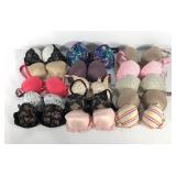 Fifteen Victoria Secret bras, various sizes from