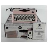 Typecast blush colored typewriter with box,