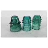 Three blue glass insulators, includes Petticoat,