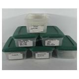 Seven Sterilite storage bins, five with lids, and