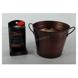 Advertising, bucket of matchbooks and coca-cola