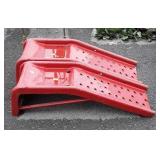 Set of red metal car ramps