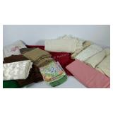 Group of linens, includes solid and lace