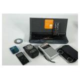 Group of small, older electronics, includes PSP