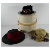 Three hopeless romantic hats with two hat boxes